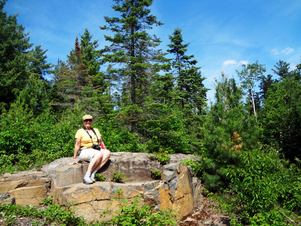 Karen rests on a sunny rock